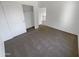 Neutral carpeted bedroom featuring a closet at 18148 W Lundberg St, Surprise, AZ 85388