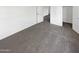 Carpeted bedroom featuring white walls and two closet access at 18148 W Lundberg St, Surprise, AZ 85388