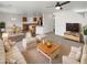 Bright, open-concept living room showcases modern furnishings and an adjacent kitchen and dining area at 18148 W Lundberg St, Surprise, AZ 85388