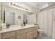 Bright bathroom with a large mirror, neutral tones, and a shower with a white curtain at 2055 N 56Th St # 15, Mesa, AZ 85215