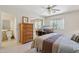 Comfortable bedroom with TV and natural light from the window and ensuite bathroom at 2055 N 56Th St # 15, Mesa, AZ 85215