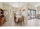 Bright dining room with a chandelier, large windows, and easy access to the backyard at 2055 N 56Th St # 15, Mesa, AZ 85215