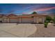 Inviting single-story home with a three-car garage and desert landscaping at 2055 N 56Th St # 15, Mesa, AZ 85215