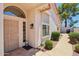 Inviting front entrance with security door, sidelight window, and desert landscaping at 2055 N 56Th St # 15, Mesa, AZ 85215