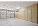 Spacious garage featuring ample storage cabinets along the side wall at 2055 N 56Th St # 15, Mesa, AZ 85215
