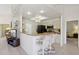 Kitchen featuring a breakfast bar, modern appliances, and bright recessed lighting at 2055 N 56Th St # 15, Mesa, AZ 85215