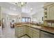 Bright kitchen with granite countertops, tile backsplash, and open layout to dining area at 2055 N 56Th St # 15, Mesa, AZ 85215