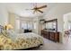 Light and airy main bedroom with ceiling fan, and natural light from the window at 2055 N 56Th St # 15, Mesa, AZ 85215