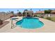 Beautiful community pool and spa surrounded by a secure fence and lush landscaping at 2055 N 56Th St # 15, Mesa, AZ 85215