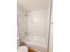 Modern bathtub with marble tile and updated fixtures, providing a relaxing retreat at 225 N Standage -- # 45, Mesa, AZ 85201