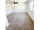 Bright, carpeted bedroom with ceiling fan and large window offers a comfortable, airy space at 225 N Standage -- # 45, Mesa, AZ 85201