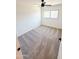Bright bedroom with neutral carpet, a ceiling fan, and window at 225 N Standage -- # 45, Mesa, AZ 85201