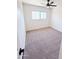 Well-lit bedroom with neutral carpet, ceiling fan, and a bright window at 225 N Standage -- # 45, Mesa, AZ 85201