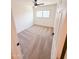 Cozy bedroom featuring soft carpet, natural light from window, and ceiling fan at 225 N Standage -- # 45, Mesa, AZ 85201
