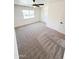 Spacious bedroom with neutral carpeting, a ceiling fan and a window for natural light at 225 N Standage -- # 45, Mesa, AZ 85201