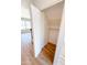 A closet with white shelving offers ample storage and complements the light hardwood flooring in this home at 225 N Standage -- # 45, Mesa, AZ 85201