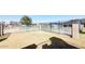 Community pool with sunshades, enclosed with black metal fencing at 225 N Standage -- # 45, Mesa, AZ 85201