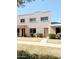 Charming two-story home with a well-maintained lawn and inviting front entrance at 225 N Standage -- # 45, Mesa, AZ 85201