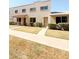 Charming two-story home with a well-maintained lawn and inviting front entrance at 225 N Standage -- # 45, Mesa, AZ 85201