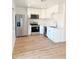 Bright kitchen features stainless appliances, white cabinetry, and modern countertops at 225 N Standage -- # 45, Mesa, AZ 85201