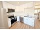 Kitchen with stainless steel appliances, white cabinets, and light countertops at 225 N Standage -- # 45, Mesa, AZ 85201