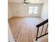 Bright living room with a ceiling fan, new floors and a front door to welcome guests at 225 N Standage -- # 45, Mesa, AZ 85201