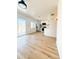 Spacious living room featuring light wood floors, and a kitchen and back yard view at 225 N Standage -- # 45, Mesa, AZ 85201