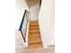 View of staircase features wood steps and black metal railing at 225 N Standage -- # 45, Mesa, AZ 85201