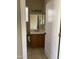 Modest bathroom featuring a vanity with storage and a mirrored medicine cabinet at 23317 N Arrellaga Dr, Sun City West, AZ 85375
