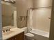 Bathroom featuring a single sink, toilet, and shower/tub with curtain at 23317 N Arrellaga Dr, Sun City West, AZ 85375