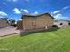 Spacious backyard with green grass, desert landscaping, and privacy fence at 2614 E Obregon St, Tempe, AZ 85288