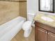 The bathroom features a shower-tub combo, granite countertops, and vanity storage space at 2614 E Obregon St, Tempe, AZ 85288