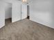 This bedroom features neutral carpeting, a ceiling fan, and access to a closet, offering comfort and functionality at 2614 E Obregon St, Tempe, AZ 85288