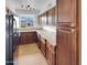 Modern kitchen with wooden cabinets, granite countertops, and stainless steel appliances at 2614 E Obregon St, Tempe, AZ 85288