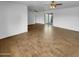 Spacious living room featuring wood-look floors, ceiling fan, and natural light at 2614 E Obregon St, Tempe, AZ 85288