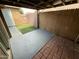 This covered patio offers a partially shaded spot with a mix of concrete and brick flooring at 2614 E Obregon St, Tempe, AZ 85288