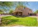 The large backyard offers ample space, a covered patio, and a view of the fenced swimming pool at 33055 N Madison Way Dr, San Tan Valley, AZ 85144