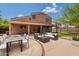 Inviting backyard featuring a covered patio, dining area and outdoor seating, perfect for entertaining at 33055 N Madison Way Dr, San Tan Valley, AZ 85144