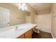 Well-lit bathroom featuring a single sink vanity, a large mirror, and a shower-tub combination at 33055 N Madison Way Dr, San Tan Valley, AZ 85144