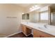 Bathroom featuring double sinks, a large mirror, and a separate shower at 33055 N Madison Way Dr, San Tan Valley, AZ 85144