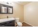 Modern bathroom features a sleek vanity with dark wood cabinets and a vessel sink at 33055 N Madison Way Dr, San Tan Valley, AZ 85144