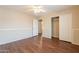 Spacious bedroom with fan, closet, and wood-look floors provides a comfortable retreat at 33055 N Madison Way Dr, San Tan Valley, AZ 85144