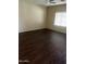 Spacious bedroom with wood floors, a ceiling fan, and bright natural light at 33055 N Madison Way Dr, San Tan Valley, AZ 85144