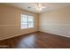Bedroom with window showcases wood-look floors and neutral paint to create cozy space at 33055 N Madison Way Dr, San Tan Valley, AZ 85144