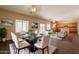 Elegant dining room set within a spacious living area offers a modern aesthetic and a comfortable gathering space at 33055 N Madison Way Dr, San Tan Valley, AZ 85144