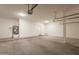 Brightly lit garage featuring a water heater, utility connections, and access to the home at 33055 N Madison Way Dr, San Tan Valley, AZ 85144