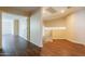 Hallway features durable flooring, neutral walls, and an open layout with staircase and doorways at 33055 N Madison Way Dr, San Tan Valley, AZ 85144