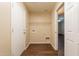 Functional laundry area features a storage shelf, washer and dryer hookups, and utility access at 33055 N Madison Way Dr, San Tan Valley, AZ 85144