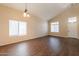 Bright living room featuring hardwood floors, vaulted ceilings, and lots of natural light at 33055 N Madison Way Dr, San Tan Valley, AZ 85144