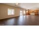 This open living room showcases wood-look floors and easy access to the kitchen and outdoor patio at 33055 N Madison Way Dr, San Tan Valley, AZ 85144